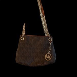 Michael kors purse with gold chain for handle goes small and long authentic